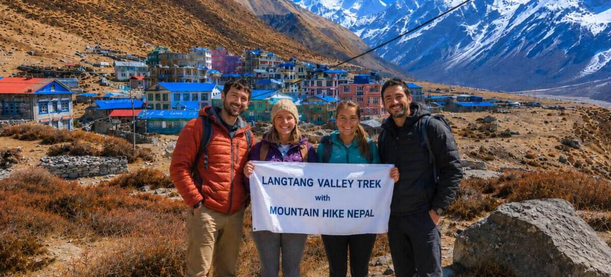 Trekkers holding Mountain Hike Nepal banner during Langtang Valley Trek near Kyanjin Gompa in Nepal