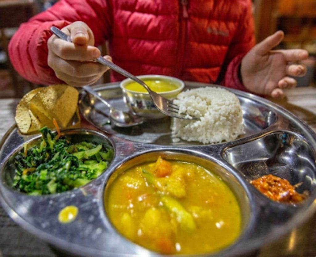 Traditional Nepali dal bhat meal served during the ABC trek in Nepal