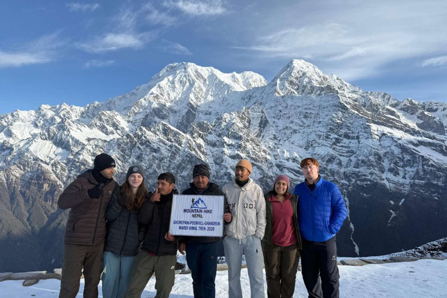 American trekkers during the Mardi Himal Trek with snowy Himalayan mountain views in Nepal