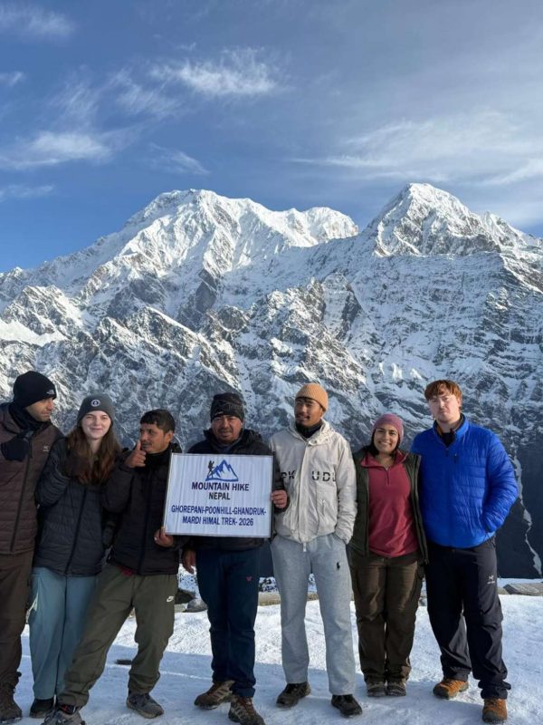 American trekkers during the Mardi Himal Trek with snowy Himalayan mountain views in Nepal