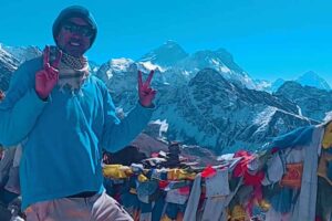 rench Solo Trekker with Prayer Flags – Everest Three Passes Trek French solo trekker with prayer flags during the Everest Three Passes Trek