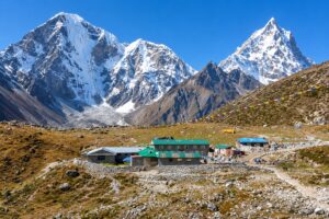 Everest Three Passes Trek – High-Altitude Himalayan Landscape High-altitude Himalayan landscape along the Everest Three Passes Trek with snow-covered mountains and stone lodges