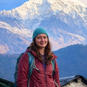 Solo female trekker in Annapurna region Nepal with mountain view
