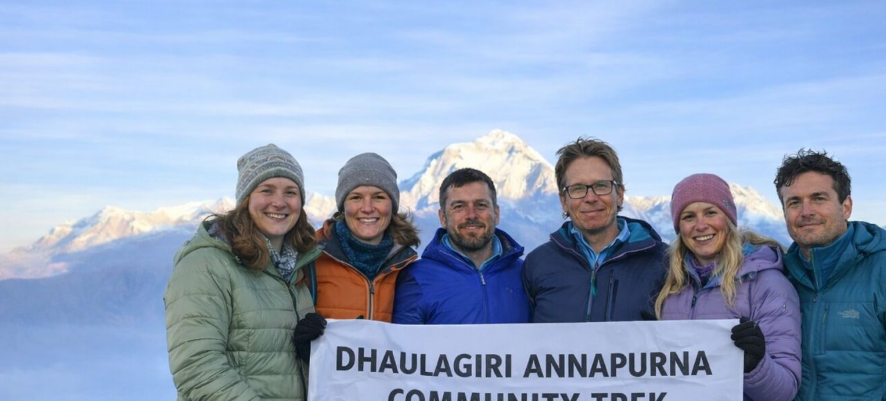 Trekkers holding a banner during the Dhaulagiri–Annapurna Community Trek in Nepal