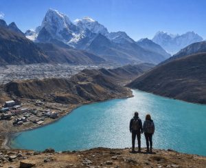 Gokyo Lake panorama in Everest region Panoramic view of Gokyo Lake surrounded by high Himalayan peaks