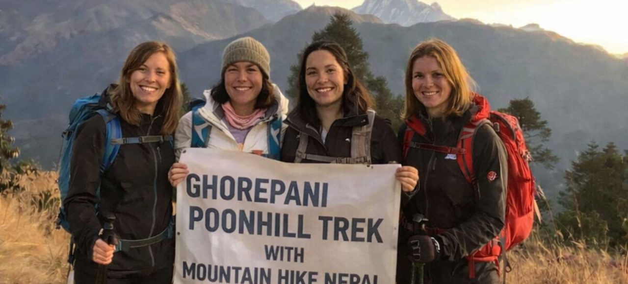 Group of trekkers at Poon Hill viewpoint on the Ghorepani Trek