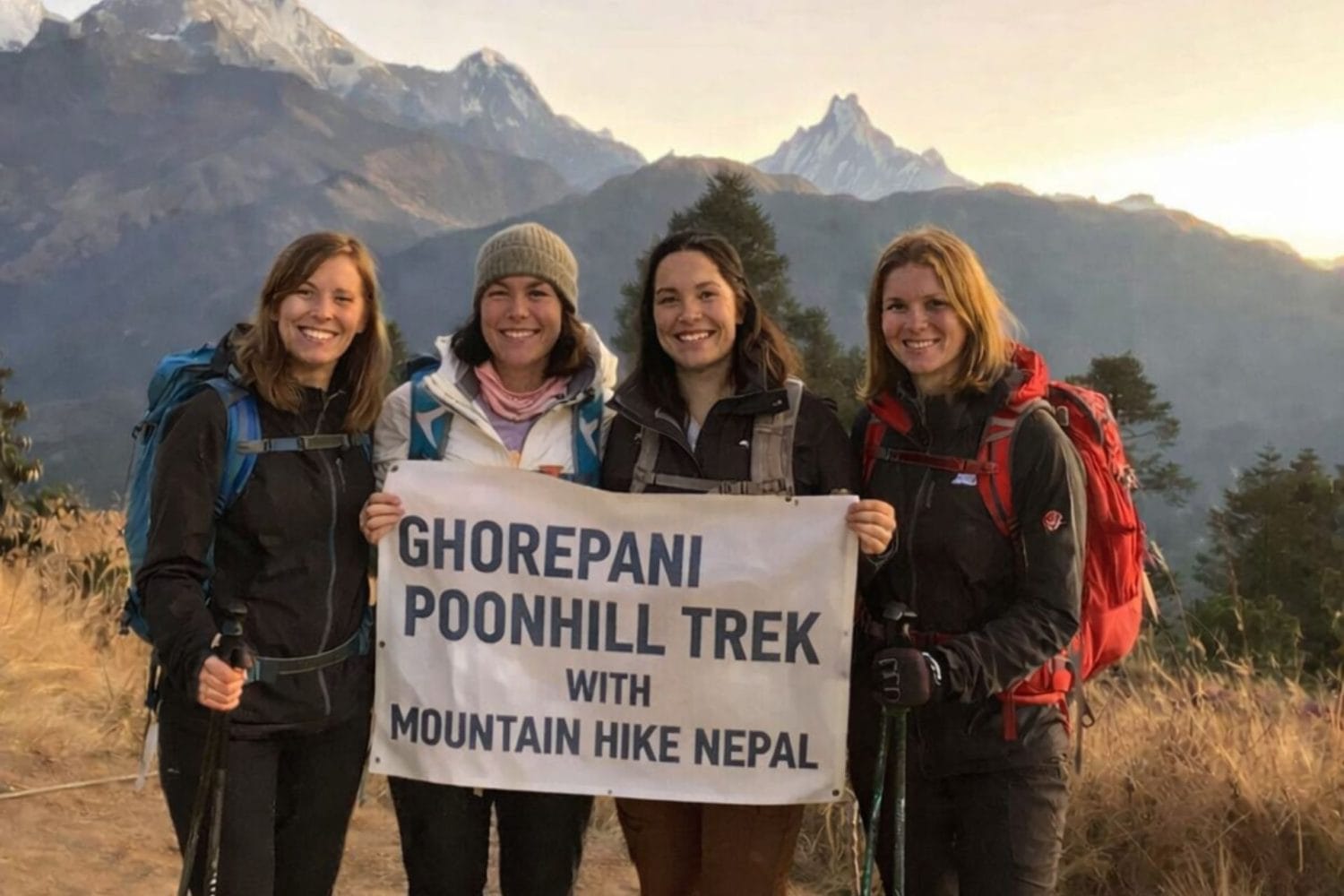 Group of trekkers at Poon Hill viewpoint on the Ghorepani Trek