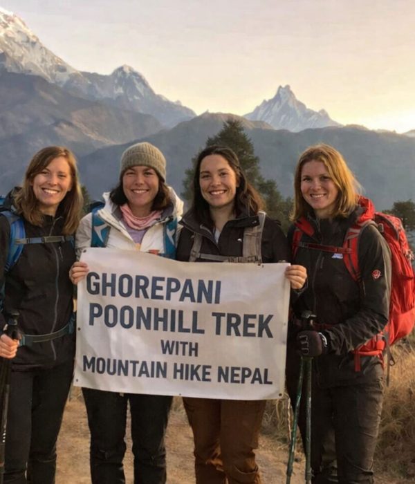 Group of trekkers at Poon Hill viewpoint on the Ghorepani Trek