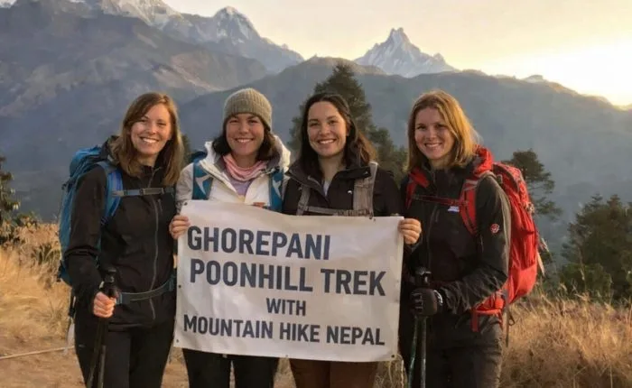 Group of trekkers at Poon Hill viewpoint on the Ghorepani Trek