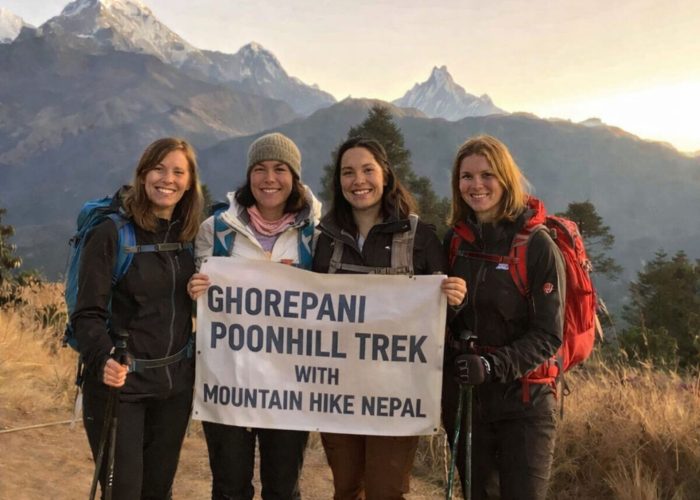 Group of trekkers at Poon Hill viewpoint on the Ghorepani Trek