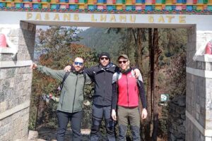 Trekkers standing beneath Pasang Lhamu Gate at Lukla on the Everest View Trek
