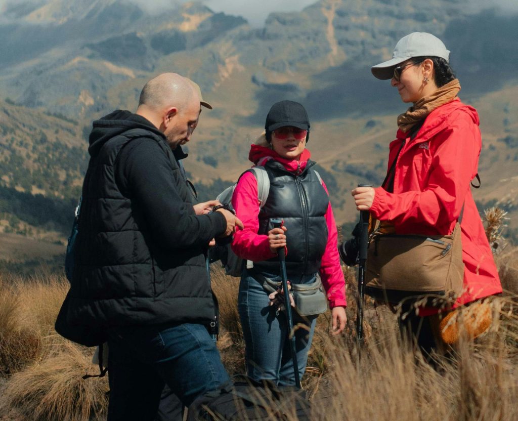 Guided trekking group discussing route during Annapurna Circuit trek Nepal