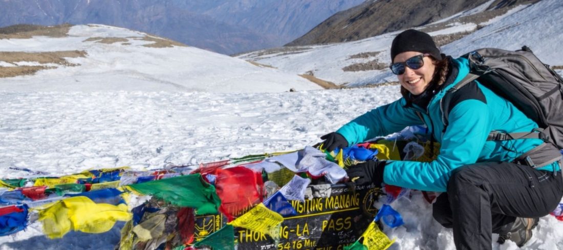 Trekker at Thorong La Pass during Annapurna Circuit Trek Cost adventure in Nepal