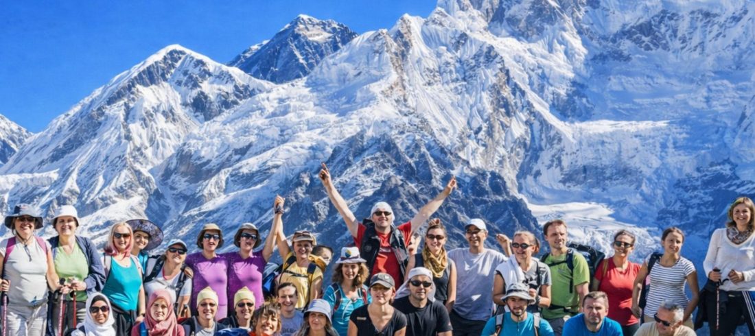 International trekkers enjoying Everest Base Camp Trek with stunning Himalayan mountain views in Nepal