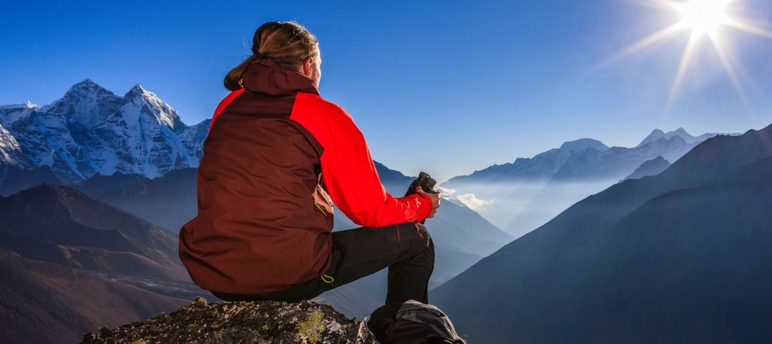 trekker enjoying Himalayan mountain view during Everest Base Camp trek Nepal