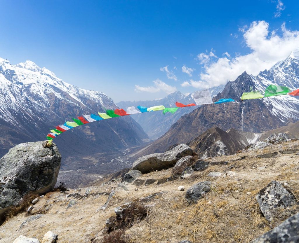 High altitude Himalayan landscape with prayer flags during trekking in Nepal