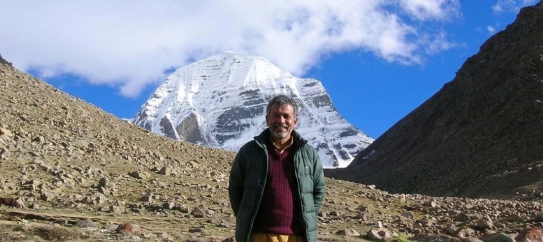 Pilgrim on the Kailash Parikrama Trek with Mount Kailash in the background