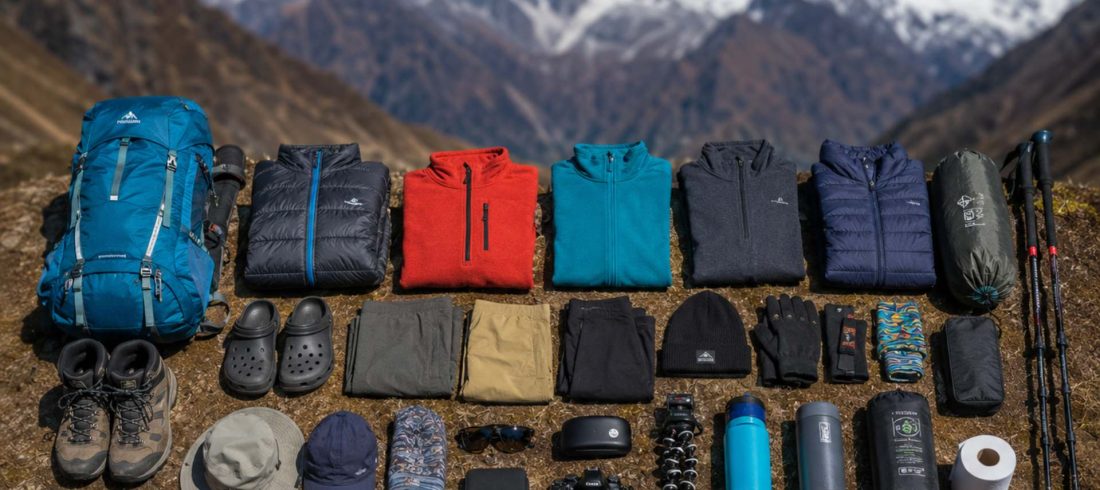 Langtang Valley packing list with trekking gear, backpack, clothing, and hiking essentials arranged in the Himalayas