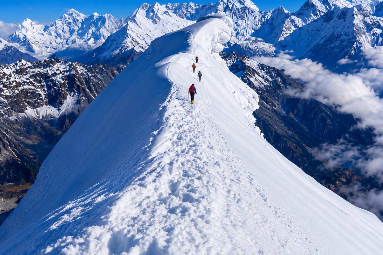Climbers ascending the snowy ridge of Lobuche Peak during a Lobuche Peak climbing expedition via Everest Base Camp and Kala Patthar in Nepal.