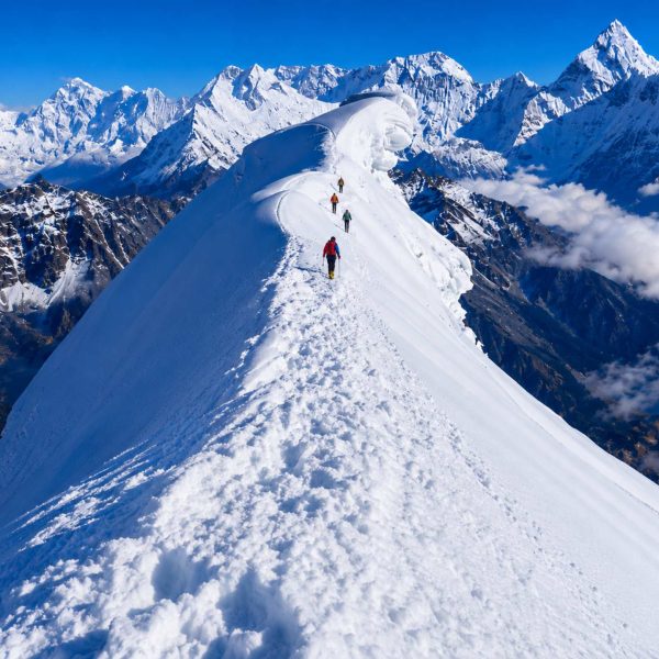 Climbers ascending the snowy ridge of Lobuche Peak during a Lobuche Peak climbing expedition via Everest Base Camp and Kala Patthar in Nepal.