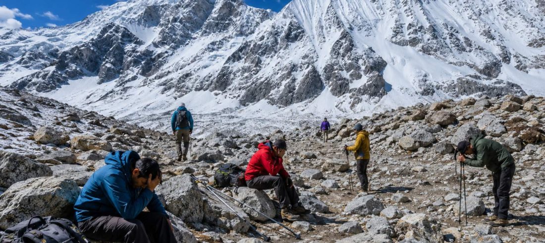 Trekkers experiencing fatigue and altitude sickness symptoms near Larkya La Pass on the Manaslu Circuit Trek in Nepal