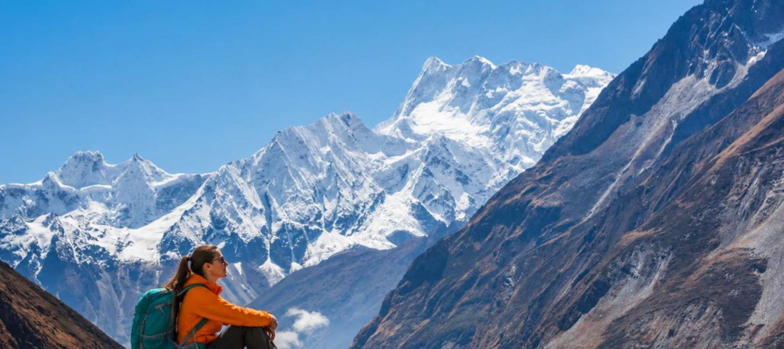 Beginner trekker enjoying mountain views on the Manaslu Circuit Trek in Nepal