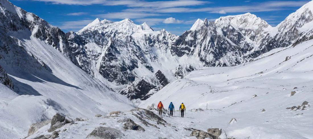 Manaslu Circuit Trek itinerary trail with trekkers crossing snowy Himalayan landscape in Nepal