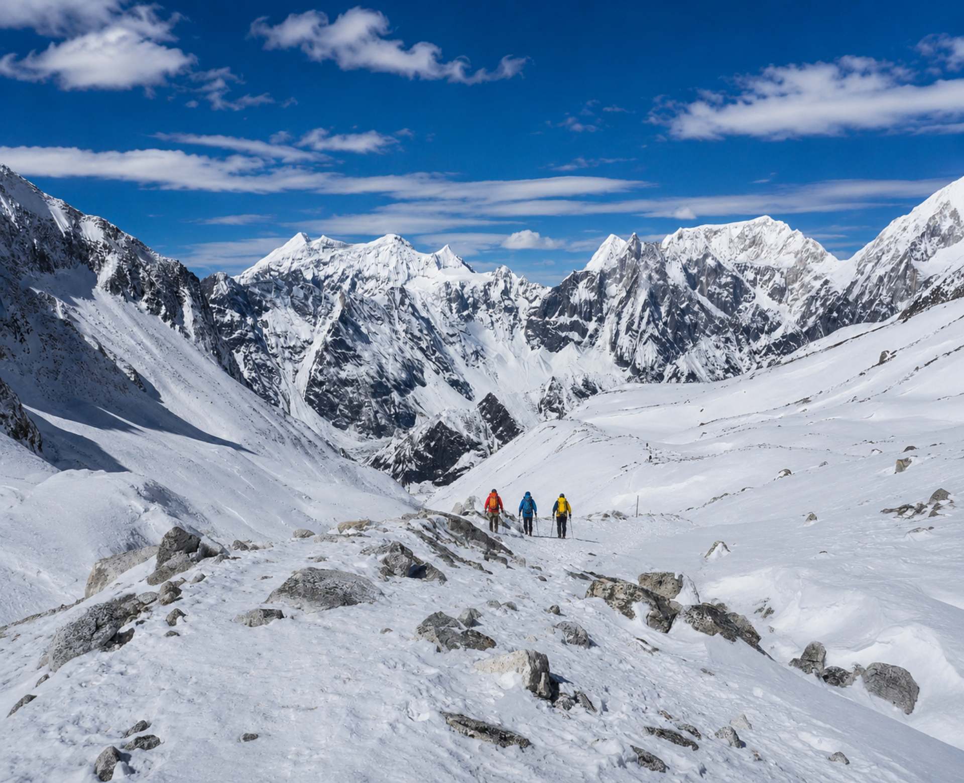 Manaslu Circuit Trek itinerary trail with trekkers crossing snowy Himalayan landscape in Nepal