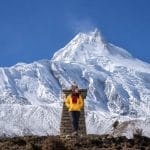 Mountain hiking in Nepal with stunning Manaslu mountain views and snowy Himalayan landscape during trekking adventure