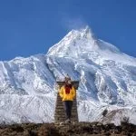 Mountain hiking in Nepal with stunning Manaslu mountain views and snowy Himalayan landscape during trekking adventure
