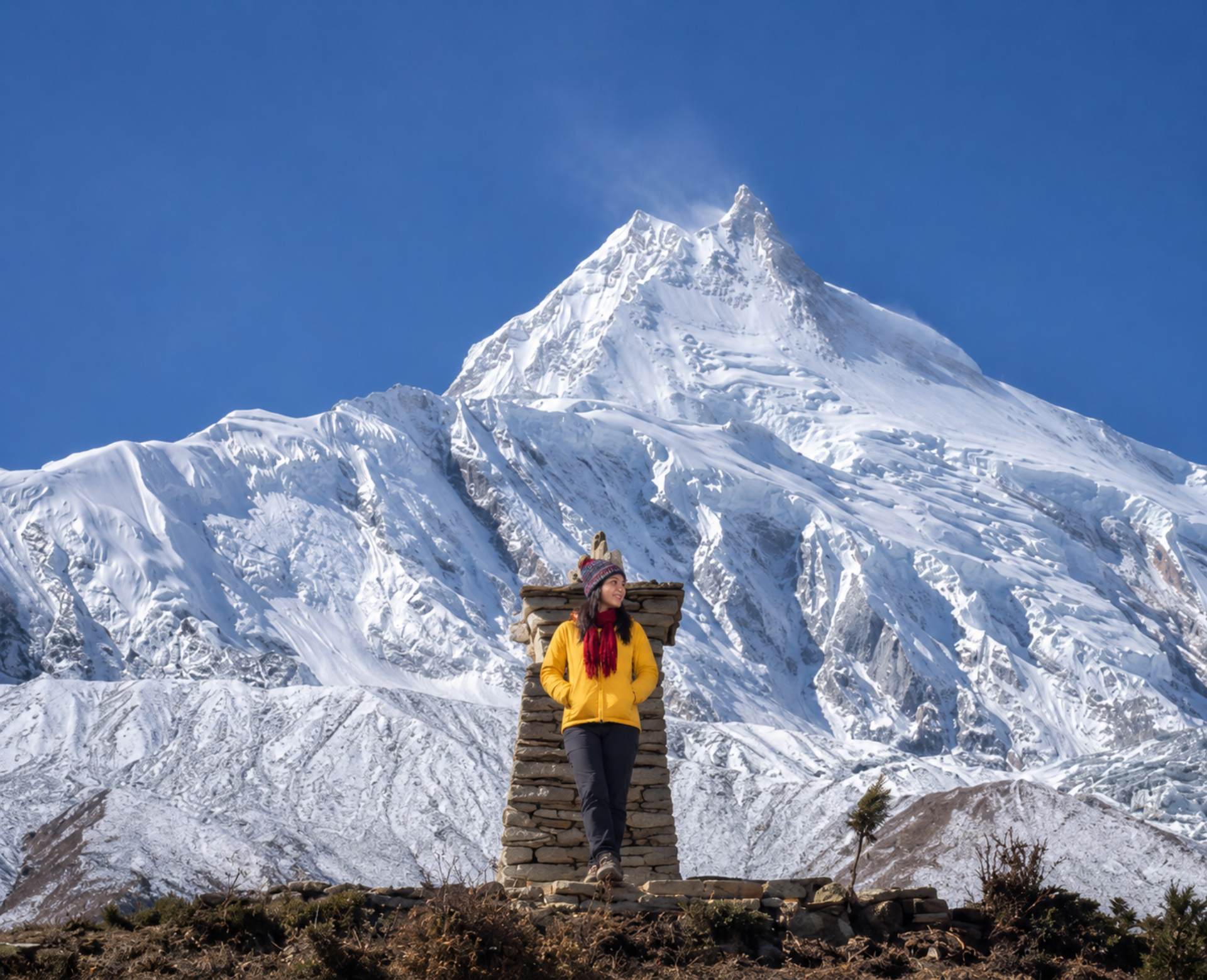 Mountain hiking in Nepal with stunning Manaslu mountain views and snowy Himalayan landscape during trekking adventure