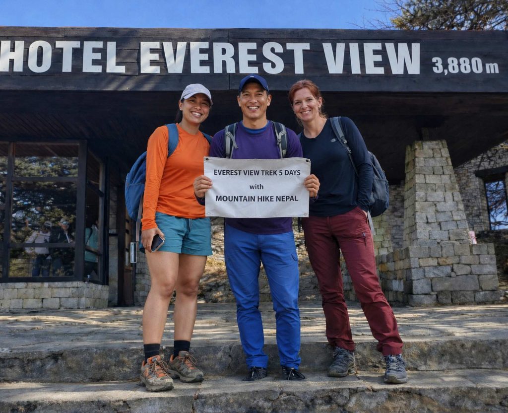 Trekkers posing with Mountain Hike Nepal banner during the Everest View Trek at Hotel Everest View (3,880m) in the Everest region of Nepal.