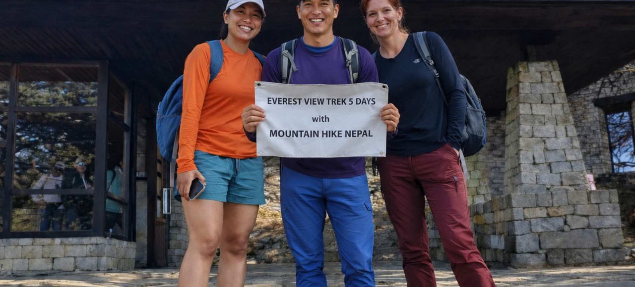 Trekkers posing with Mountain Hike Nepal banner during the Everest View Trek at Hotel Everest View (3,880m) in the Everest region of Nepal.