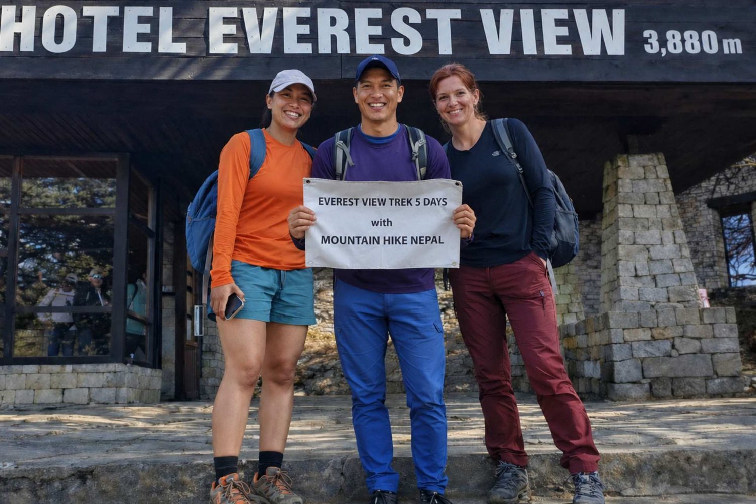 Trekkers posing with Mountain Hike Nepal banner during the Everest View Trek at Hotel Everest View (3,880m) in the Everest region of Nepal.