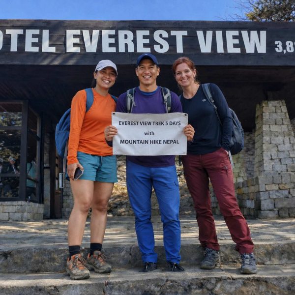 Trekkers posing with Mountain Hike Nepal banner during the Everest View Trek at Hotel Everest View (3,880m) in the Everest region of Nepal.
