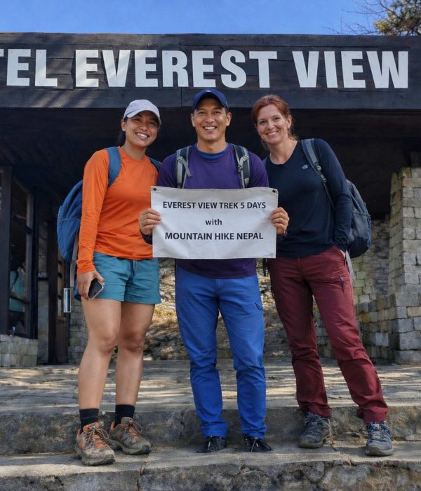 Trekkers posing with Mountain Hike Nepal banner during the Everest View Trek at Hotel Everest View (3,880m) in the Everest region of Nepal.
