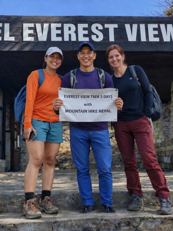 Trekkers posing with Mountain Hike Nepal banner during the Everest View Trek at Hotel Everest View (3,880m) in the Everest region of Nepal.