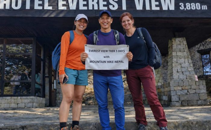 Trekkers posing with Mountain Hike Nepal banner during the Everest View Trek at Hotel Everest View (3,880m) in the Everest region of Nepal.