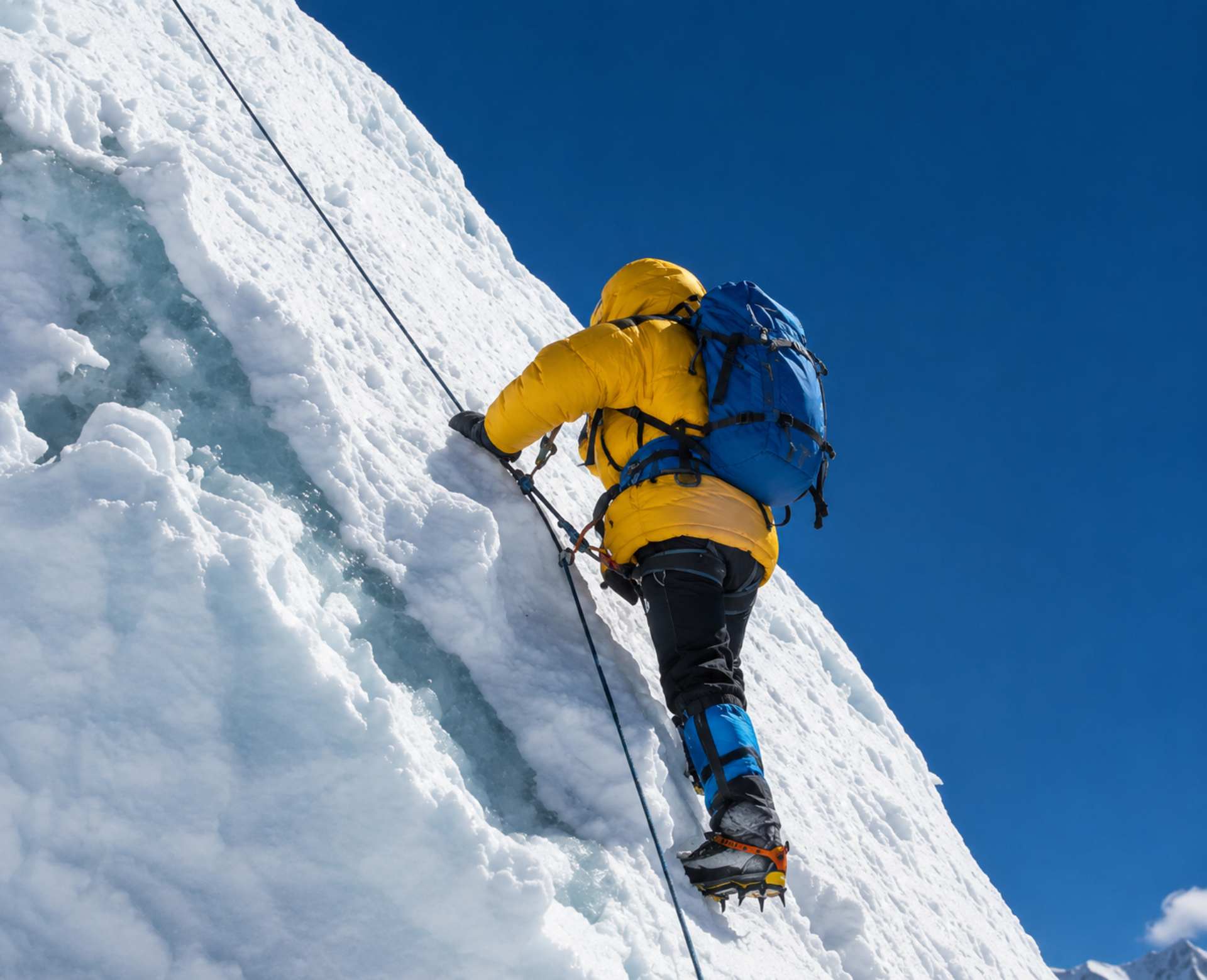 Beginner climber ascending a fixed rope section on Island Peak in Nepal