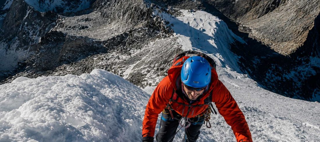 Mountaineer climbing a steep icy slope during the challenging Lobuche Peak Climbing expedition in Nepal