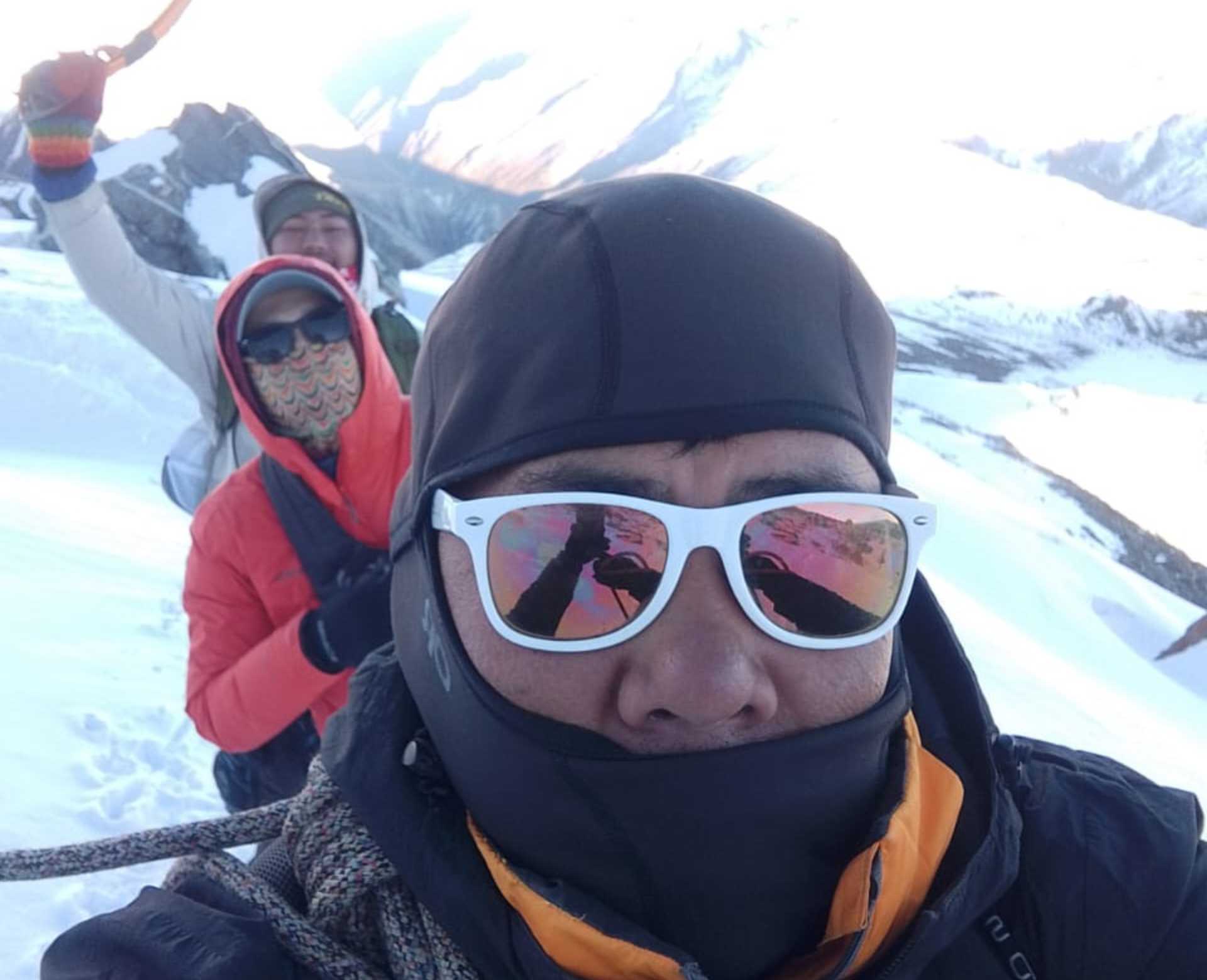 Climbers roped together crossing snowy terrain during Yala Peak climbing in the Langtang region of Nepal.