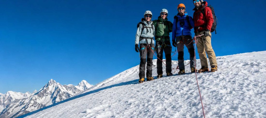Climbers on the snowy slopes of Yala Peak in Langtang National Park, Nepal.
