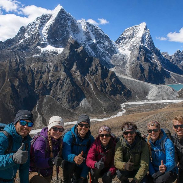 Trekkers enjoying the panoramic mountain views during the Nangkartshang Peak Trek in Nepal's Everest region.