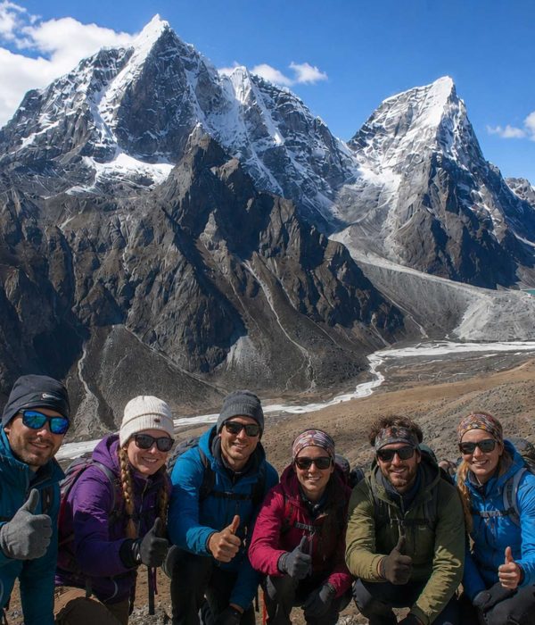 Trekkers enjoying the panoramic mountain views during the Nangkartshang Peak Trek in Nepal's Everest region.