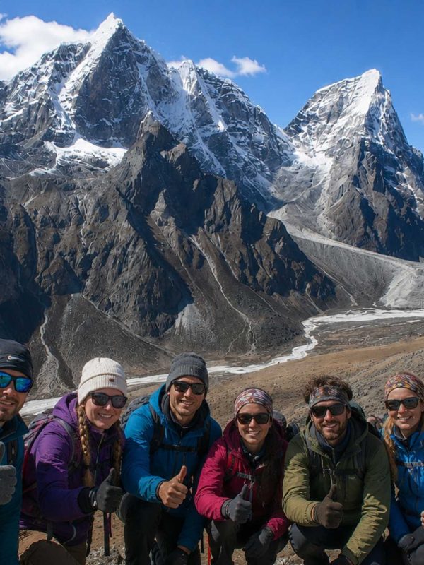 Trekkers enjoying the panoramic mountain views during the Nangkartshang Peak Trek in Nepal's Everest region.
