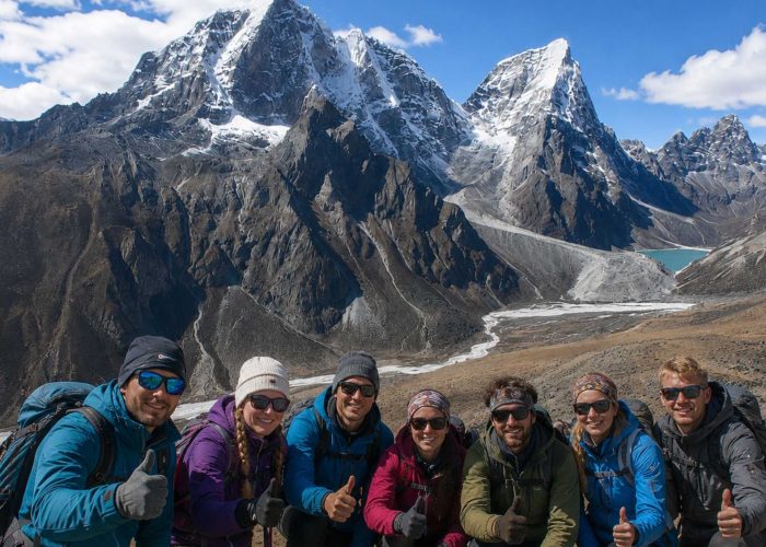 Trekkers enjoying the panoramic mountain views during the Nangkartshang Peak Trek in Nepal's Everest region.