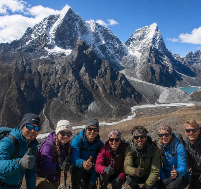 Trekkers enjoying the panoramic mountain views during the Nangkartshang Peak Trek in Nepal's Everest region.