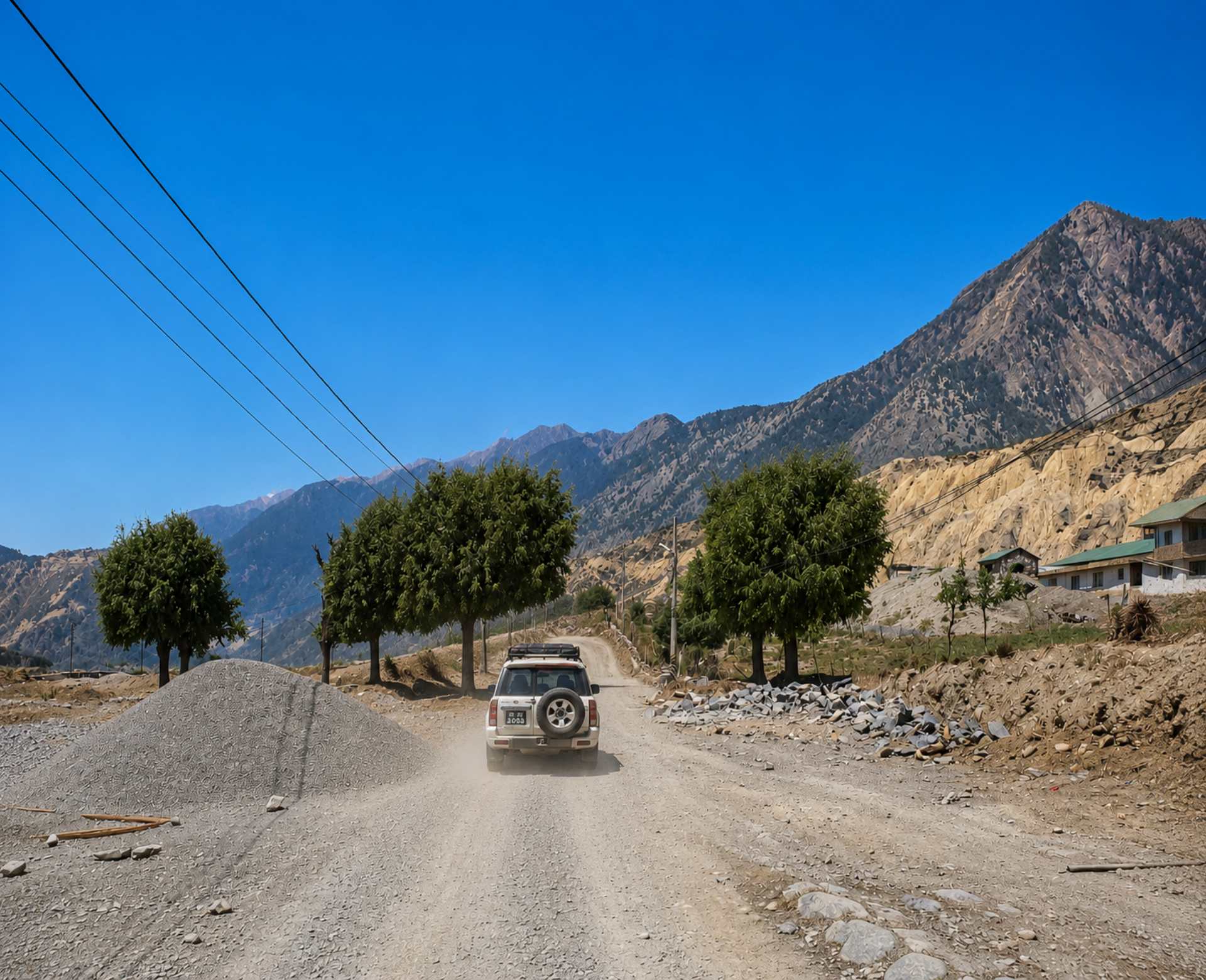 Rara Lake Jeep Tour – Scenic Off-Road Drive to Rara Lake 4WD jeep driving on a rugged mountain road during the Rara Lake Jeep Tour in western Nepal