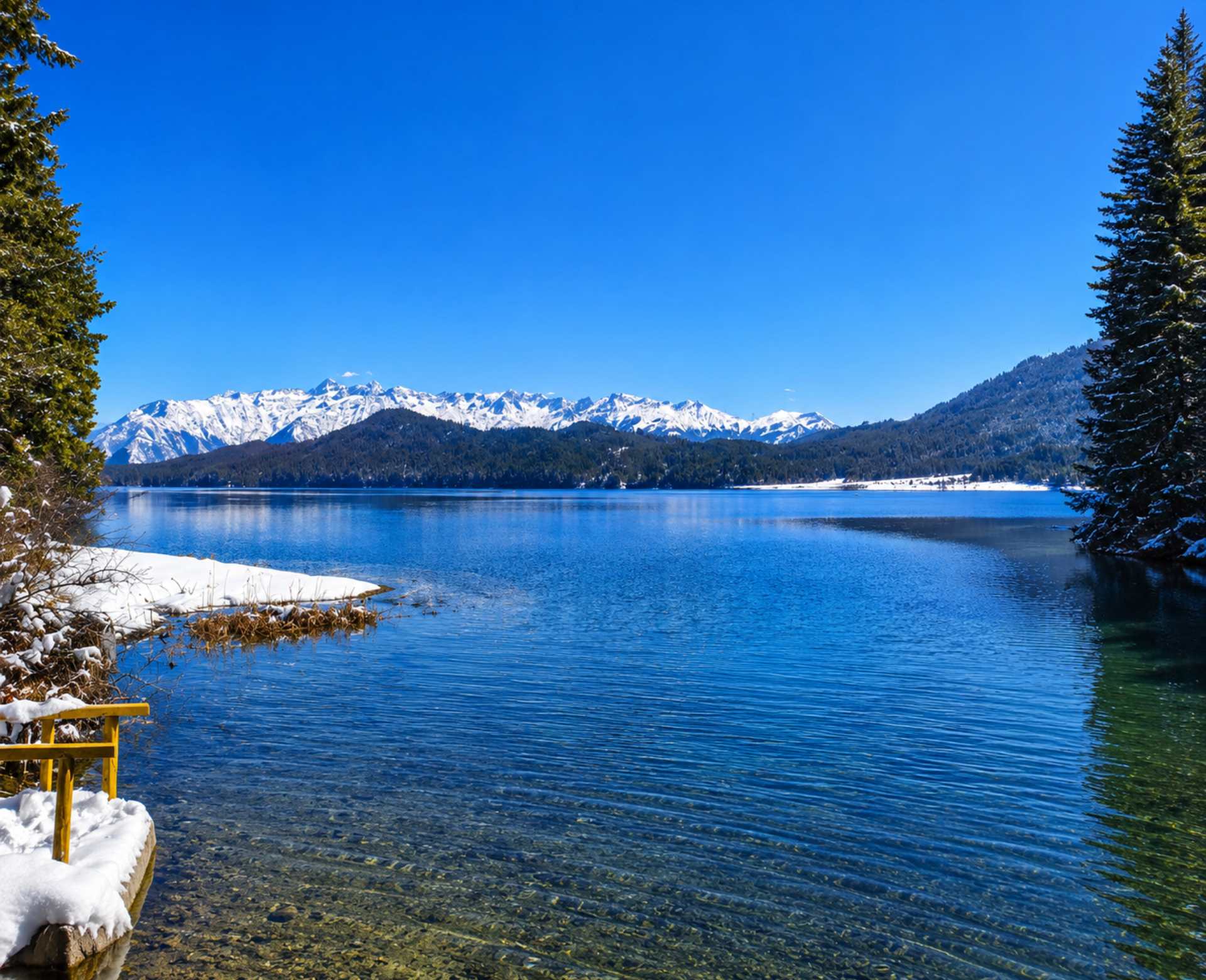 raRara Lake Jeep Tour – Winter Panorama of Rara Lakeara-lake-jeep-tour-winter-view Winter view of Rara Lake during the Rara Lake Jeep Tour with crystal-clear blue water and snow-capped mountains in Nepal