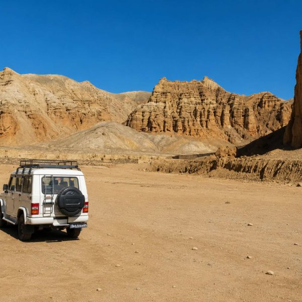 4WD jeep exploring the dramatic desert landscape on the Upper Mustang Overland Tour in Nepal